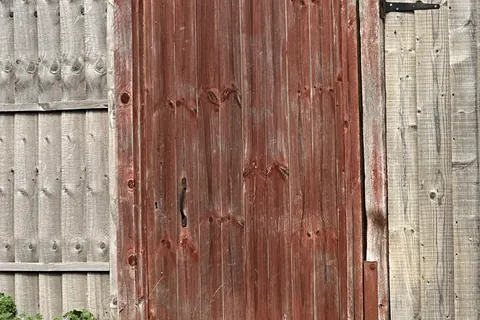 Wooden garden gate and residential fence