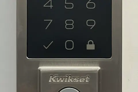 Electronic deadbolt keypad on a door
