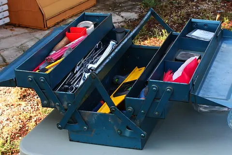 Open toolbox containing repair tools
