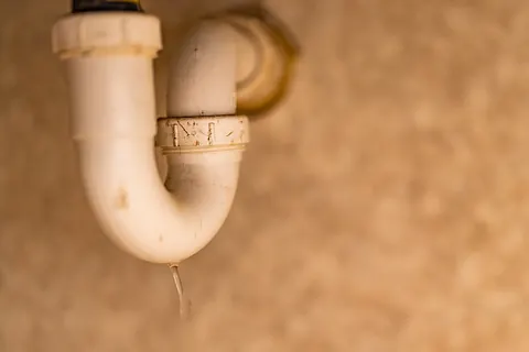 P-trap plumbing beneath a sink