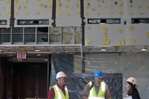 Workers restoring an interior after water damage